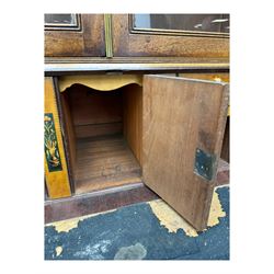 Early 19th century mahogany bureau bookcase, the projecting cornice over two Gothic-style astragal glazed doors enclosing two adjustable shelves, sloped hinged lid enclosing fitted interior and felt inset, four graduating drawers, on bracket feet