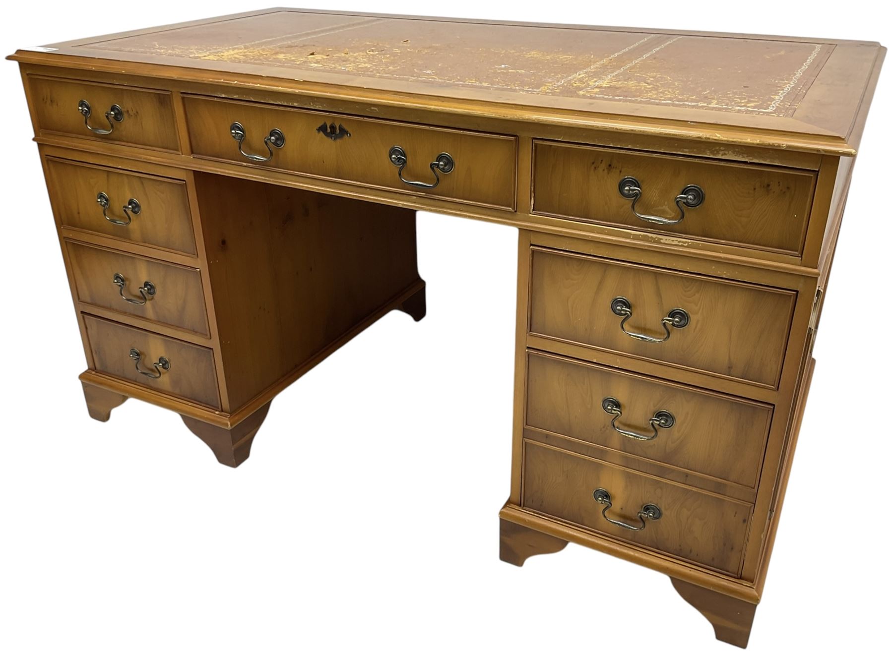 Georgian design yew wood twin pedestal desk, moulded rectangular top over nine cock-beaded drawers, on bracket feet