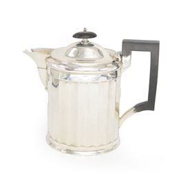 1920s silver hot water pot, of oval faceted form, with Bakelite type handle and finial, ha...