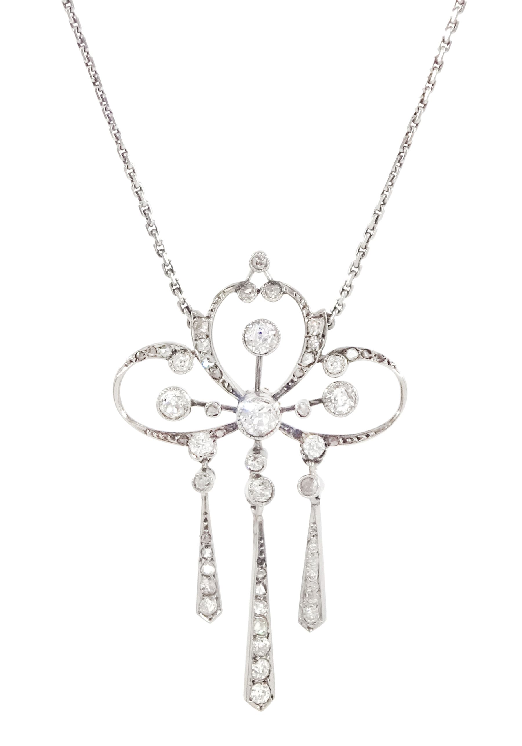 Early 20th century platinum and silver diamond pendant, four milgrain set old cut diamonds of approx 0.40 carat, with rose and old cut diamond set openwork surround, suspending three kite shaped pendants set with diamonds, on detachable screw back platinum trace link chain necklace