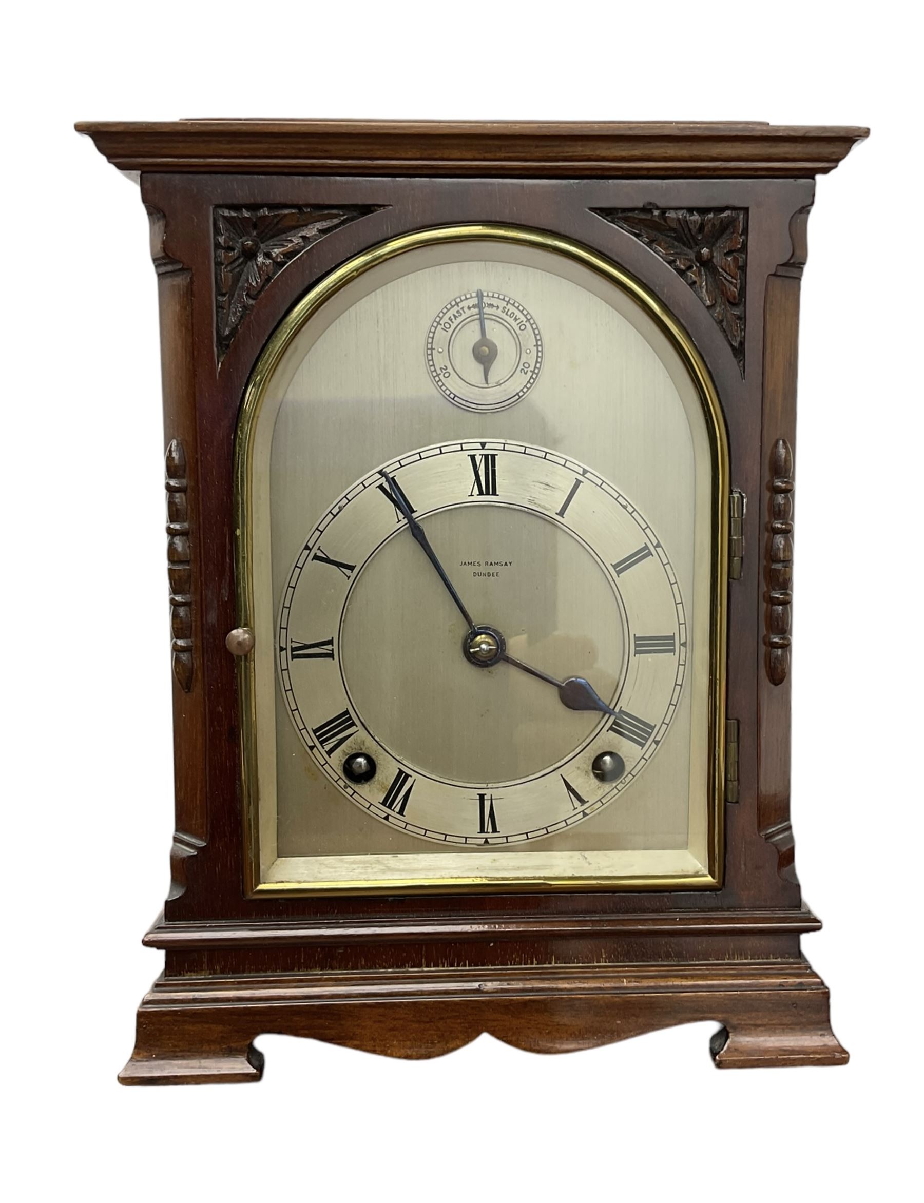 Continental early 20th century mahogany cased 8-day mantle clock, rectangular case with a flat top and fully glazed arched door to the silvered dial, separate chapter with Roman numerals, minute track and steel spade hands, subsidiary time regulation dial, with a twin train Westminster chiming movement, lever platform escapement and four gong rods. Retailed by James Ramsay, Dundee.