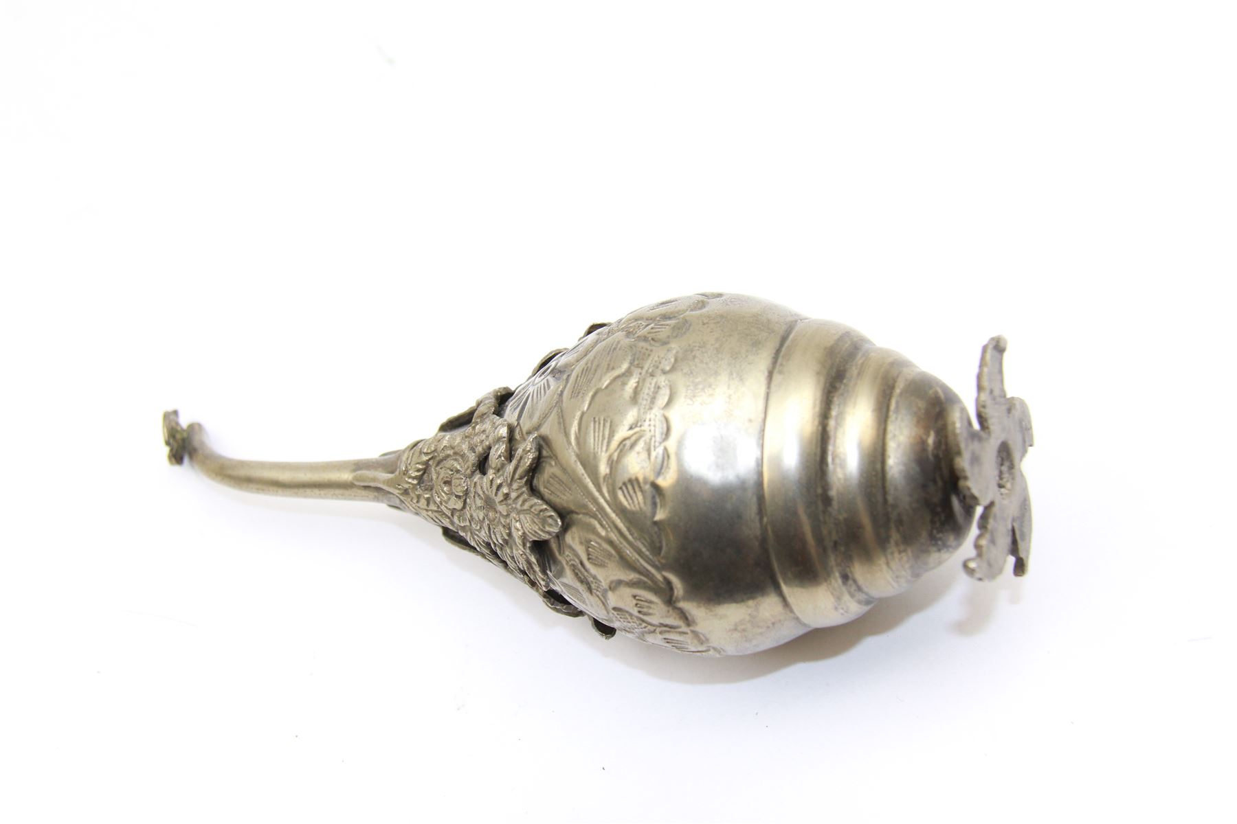 Egyptian white metal rosewater sprinkler, the pear shaped body embossed with flowers, the screw top with applied rose and bird decoration, upon foliate base, H20cm