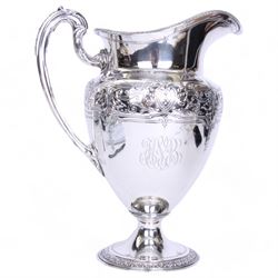 Large late 19th/early 20th century American silver pitcher, the body of ovoid form with embossed and chased foliate band, and acanthus capped scroll handle, upon a spreading circular foot with stiff leaf border, marked for Reed & Barton, Taunton, Massachusetts, and stamped Sterling, H27cm

