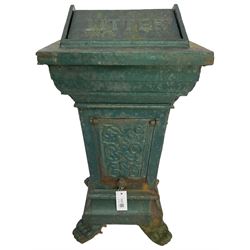 Early 20th century cast iron litter bin, square tapering form with scrolling foliate decoration, on paw feet