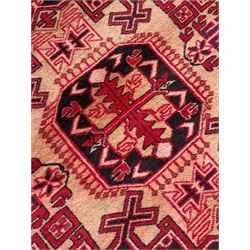 Persian Hamadan indigo and crimson ground rug, the field filled with three shaped medallions, overall geometric design, decorated with sandikli and hac motifs, geometric main border with repeating hooked motifs, within guard stripes decorated with small flower heads, outer crenelated fence band 