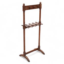 19th century mahogany whip and boot stand, ring turned pillars supporting six turned hooks and recessed boot holders, on arched out splayed feet 