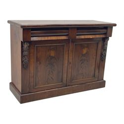 Mid 19th century mahogany sideboard, rectangular top over two frieze drawers with rounded edges, flanked by floral carved corbels, over two panelled cupboard doors, raised on a plinth base