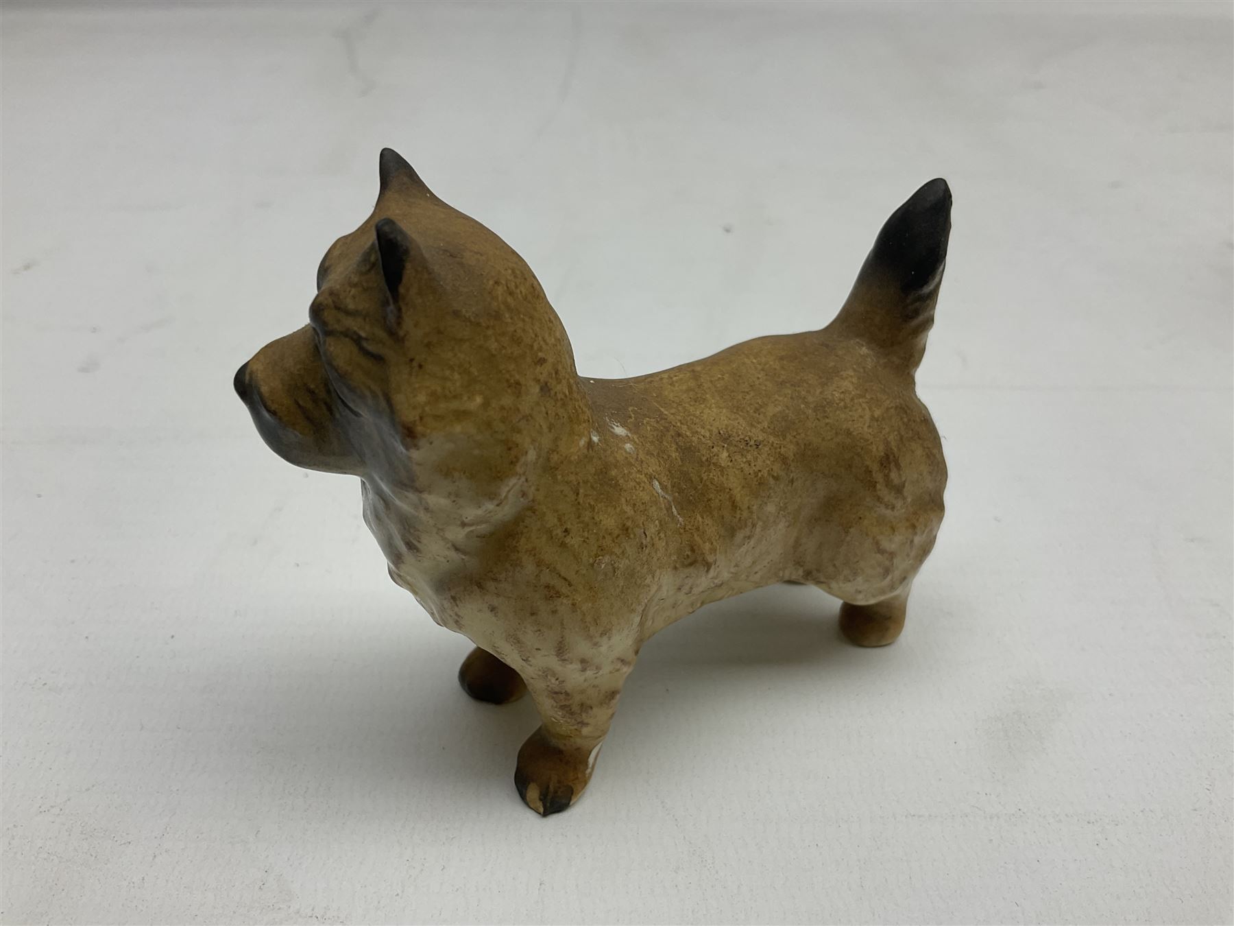 Five Beswick figures, comprising Wooly Shetland no 1033, Wooly Shetland Foal no.1034, Cairn Terrier no.2112, large Fox no. 1016 and standing fox no. 1440