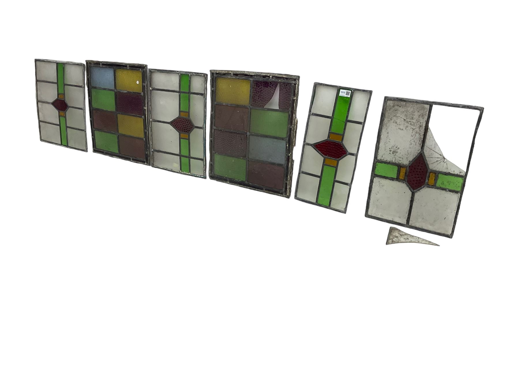 Six leaded stained glass window panes, largest measuring - 46cm x 41cm