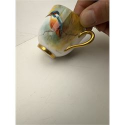 Royal Worcester cabinet cup, decorated with a kingfisher upon a branch by H. Powell, artist signed, together with matching saucer by other artist