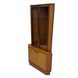 Nathan - teak corner display cabinet, double glazed doors enclosing two adjustable shelves over single cupboard.