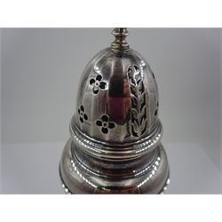 1920s silver sugar caster, of typical form with faceted body and pierced floral cover, upon stepped circular foot, hallmarked Adie Bros, Birmingham 1928, H20cm