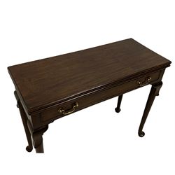 George III mahogany card table, moulded rectangular fold-over top revealing baize lined interior, single cocked-beaded frieze drawer with brass swan neck handles, on lappet carved cabriole supports, double gate-leg action base 