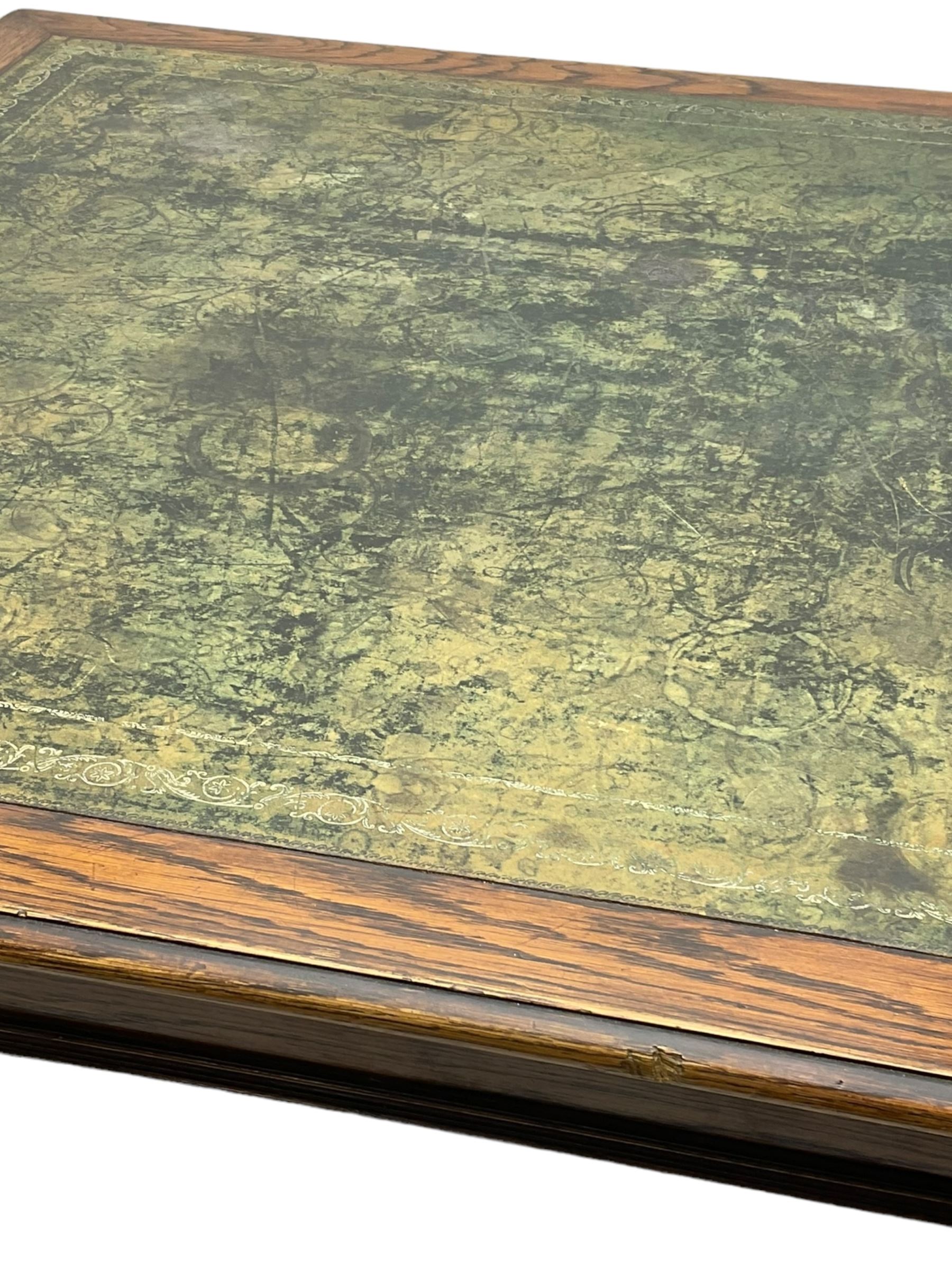 Large 10' 7'' late Victorian oak boardroom table, moulded rectangular top with inset green leather surface, on turned and reed moulded supports with brass and ceramic castors 