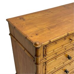 Victorian pine and simulated bamboo chest, fitted with five drawers, the drawer fronts decorated with applied simulated bamboo mounts and turned ebonised handles, on turned front feet