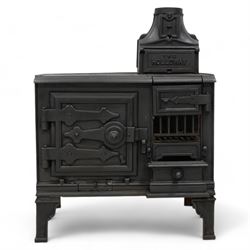 'The Holloway' cast iron portable range stove, fitted with surface burners and oven, on angular bracket feet 