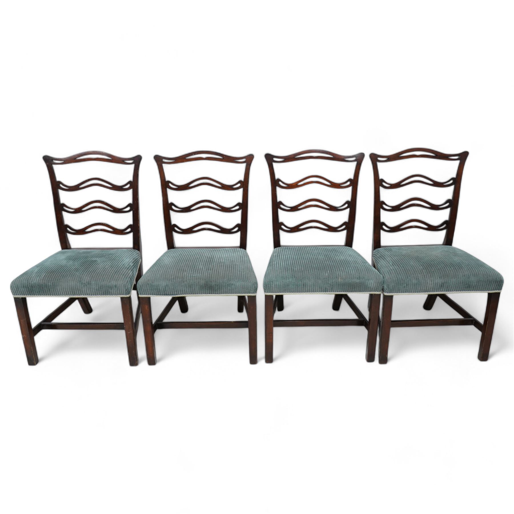 Set of six (4+2) Chippendale Revival stained beech dining chairs, pierced waived ladder backs with over-stuffed seats, on square moulded supports joined by stretchers