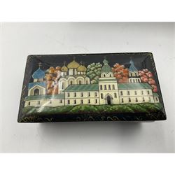 Six 20th century Russian black lacquered papier Mache boxes, decorated with landscapes and townscapes 