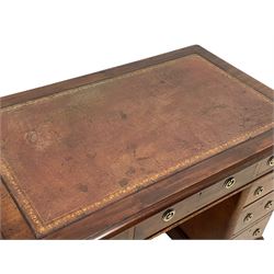 Victorian mahogany twin pedestal desk, moulded rectangular top with rounded corners and inset leather writing surface, fitted with nine drawers, on moulded plinth base