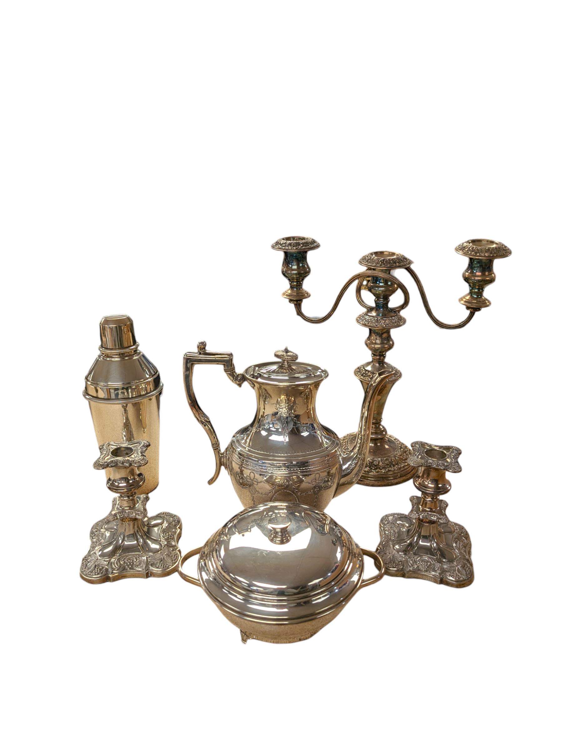 Silver plated items, including cocktail shaker, candelabra, pair of candlesticks, coffee pot and serving dish