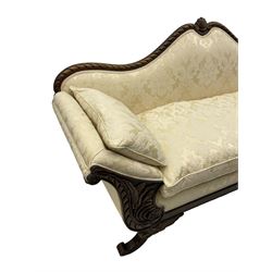 Victorian design walnut framed settee, shaped camelback with gadroon carved edge and central feather motif, upholstered in cream damask fabric with scrolling floral pattern, S-scroll arm facias carved with flower head and curled leaves, feather carved C-scroll splayed feet 