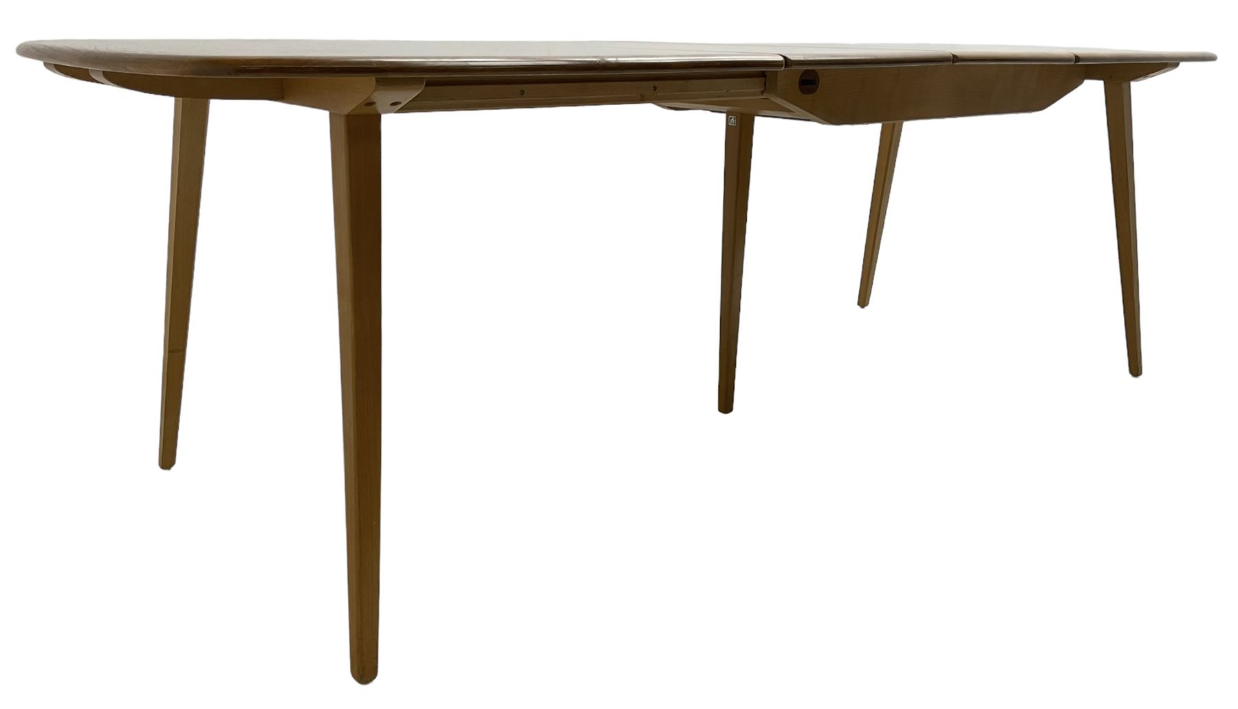 Ercol - light elm and beech 'Slide Leg Expanding Dining Table (444)', rectangular top with rounded corners, raised on tapered splayed supports, with two additional leaves