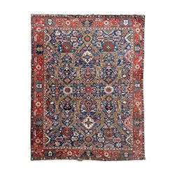 Persian blue ground carpet, the field divided up into panels by trailing bands with flower...