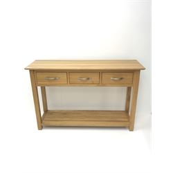 Light oak side console table, three drawers, square supports joined by solid undertier