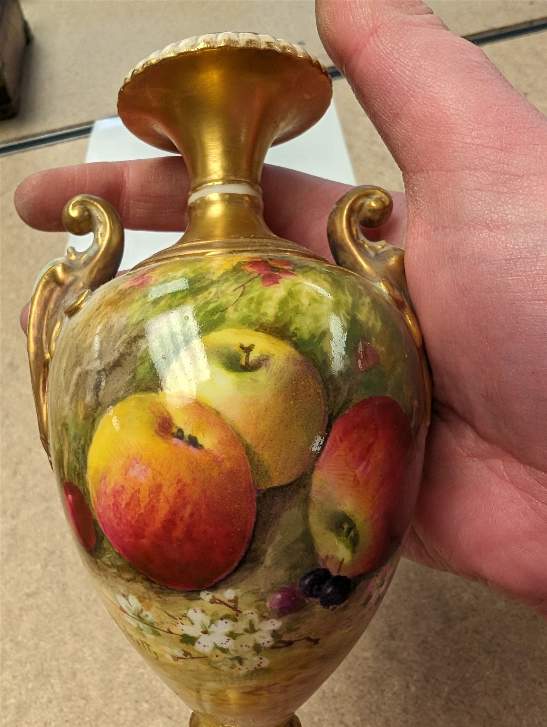 Royal Worcester vase, decorated with fruits among blossom with gilt detailing, H17cm