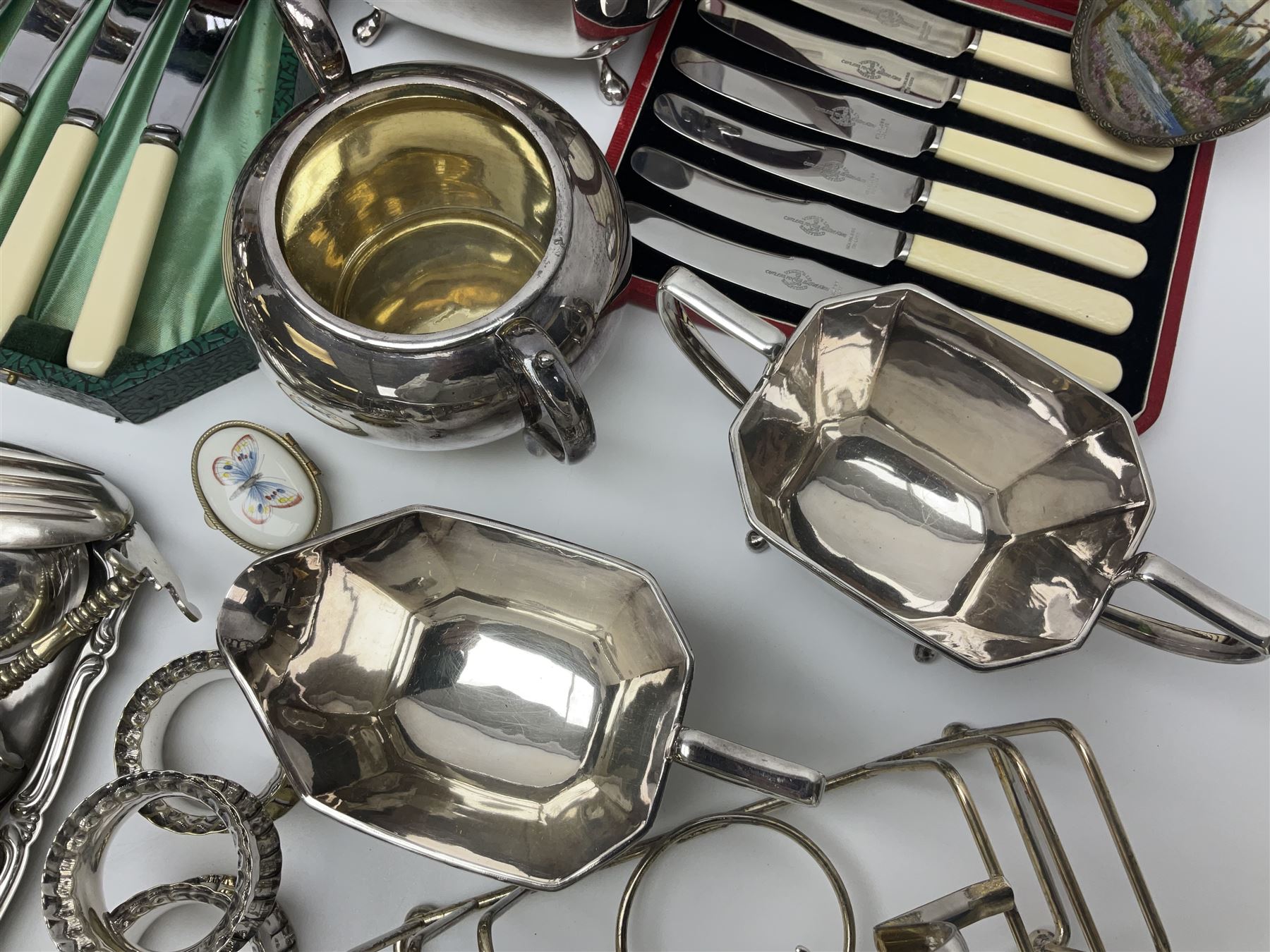 Silver plated four piece tea service, comprising teapot, coffee pot, open sucrier and milk jug, together with card case embossed with animals, flatware etc, 