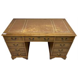 Georgian design yew wood twin pedestal desk, moulded rectangular top over nine cock-beaded drawers, on bracket feet