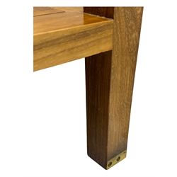 Starbay Tobago cherry wood coffee table, rectangular top with two inset glass panels, central drawer with louvred front and brass handles, flanked by open shelving, raised on square supports with metal corner brackets