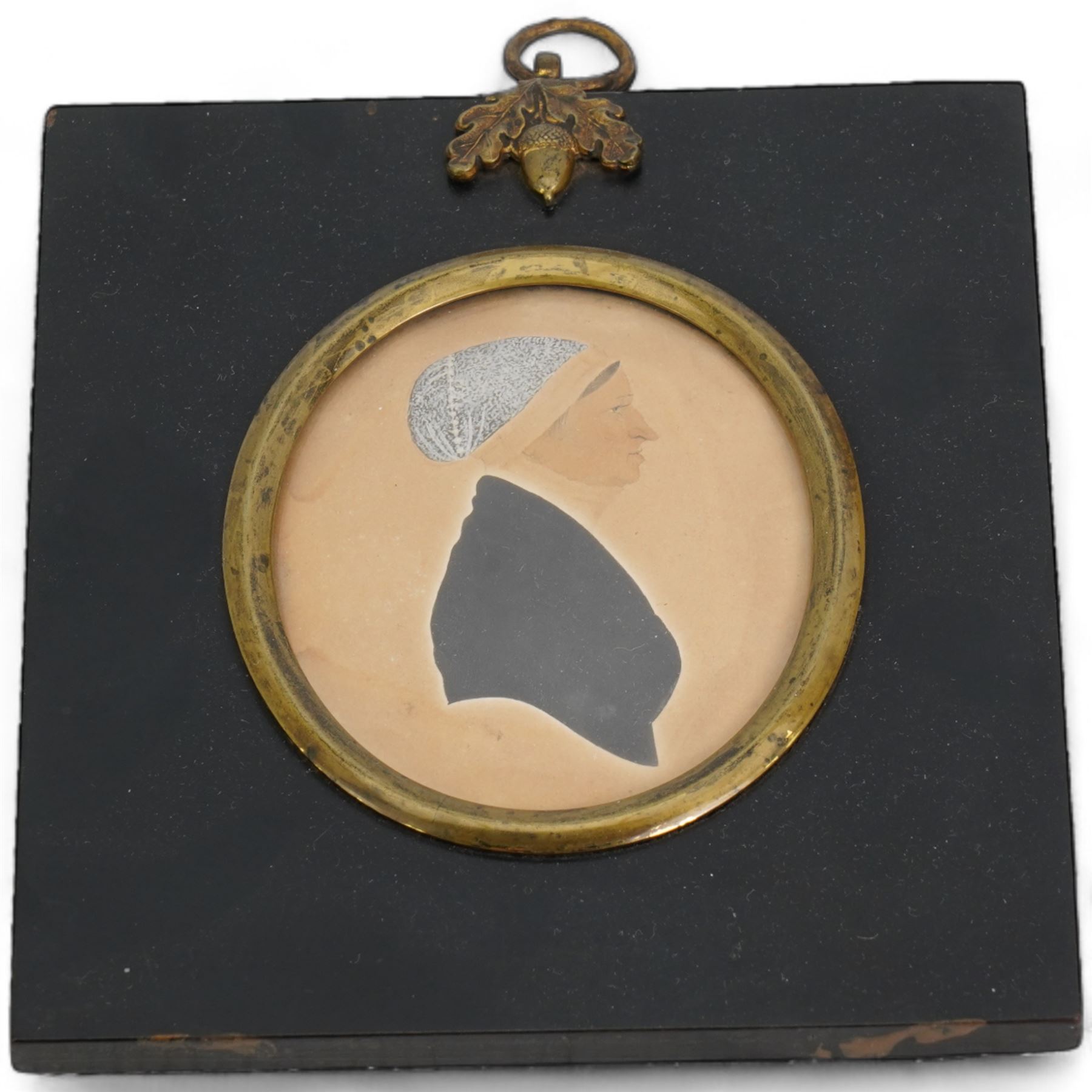 Pair of 19th century oval hand-coloured silhouettes of 'The Reverend D Isaac - Preacher of the Gospel 1859' and 'Mrs D Isaac Coningsby', in ebonised frames; together with another similar 13cm x 11cm (3)