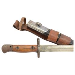 Lee Enfield bayonet in steel mounted leather scabbard, together with another bayonet