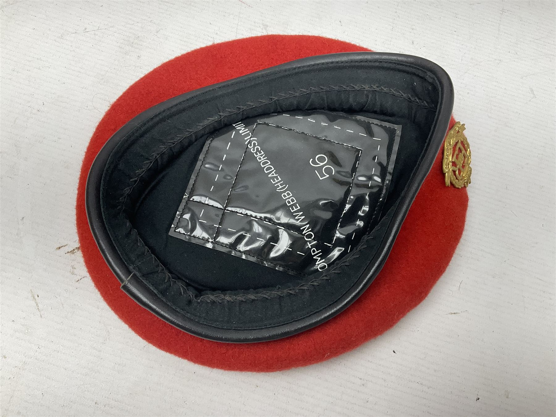 Five military caps/berets comprising two peaked caps with 'Yorkshire' and 'Royal Engineers' badges; maroon beret with parachute regiment badge; red beret with Military Police badge; and AB seaman hat with HM Submarines band; and a felt and webbing covered water bottle (6)