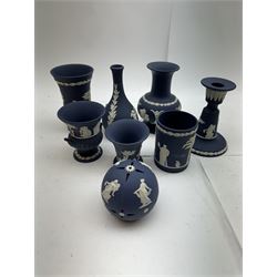 Wedgwood dark blue Jasperware, including candlestick, vases, trinket tray, covered trinket boxes etc 