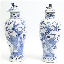 Pair of 19th/ early 20th century Chinese blue and white vases and covers, each of baluster...