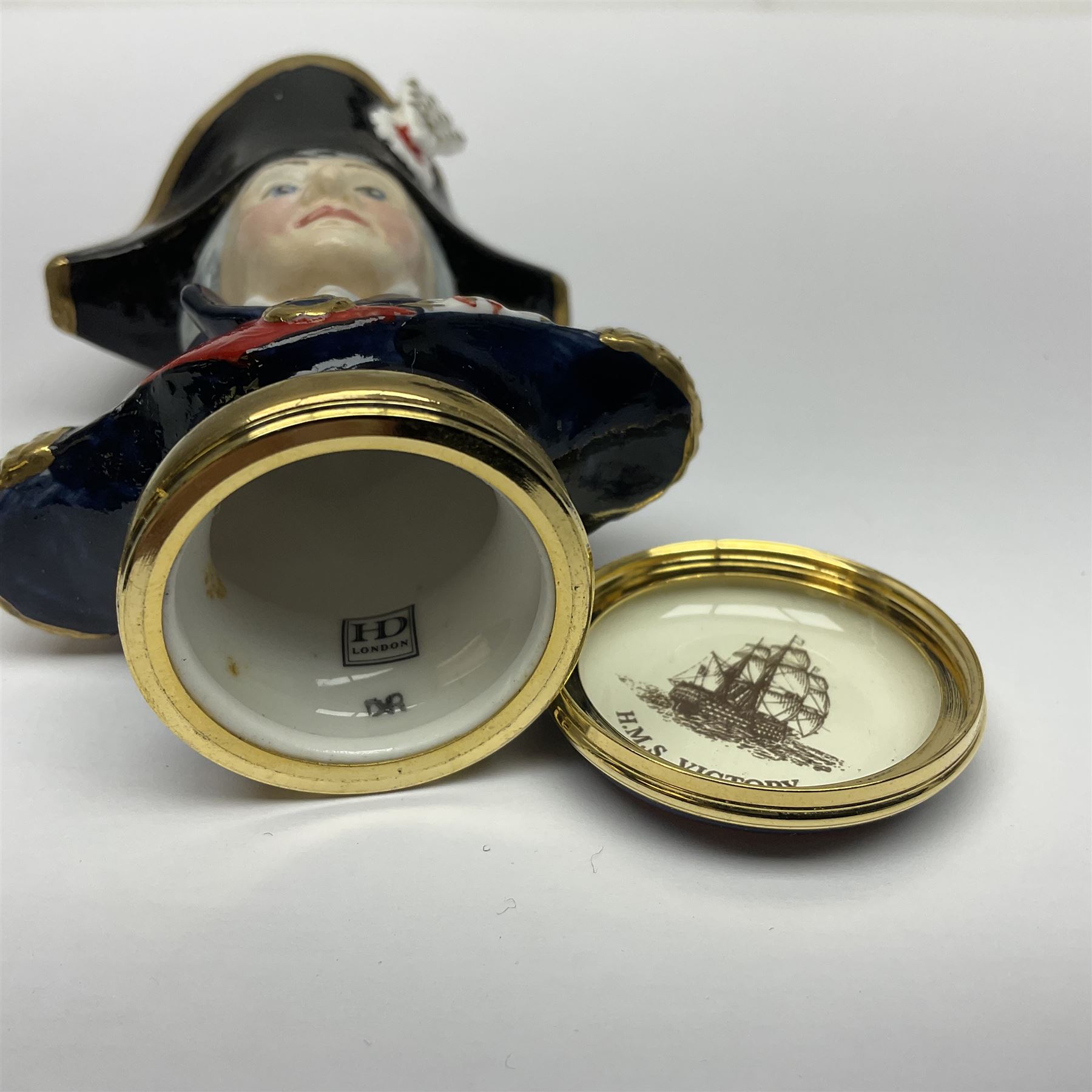 Halcyon Days bonbonniere, modelled as 'Vice-Admiral Lord Nelson', to mark the bicentenary of the British victory at the Battle of Trafalgar, together with another Halcyon Days enamel box depicting Lord Nelson, both boxed 