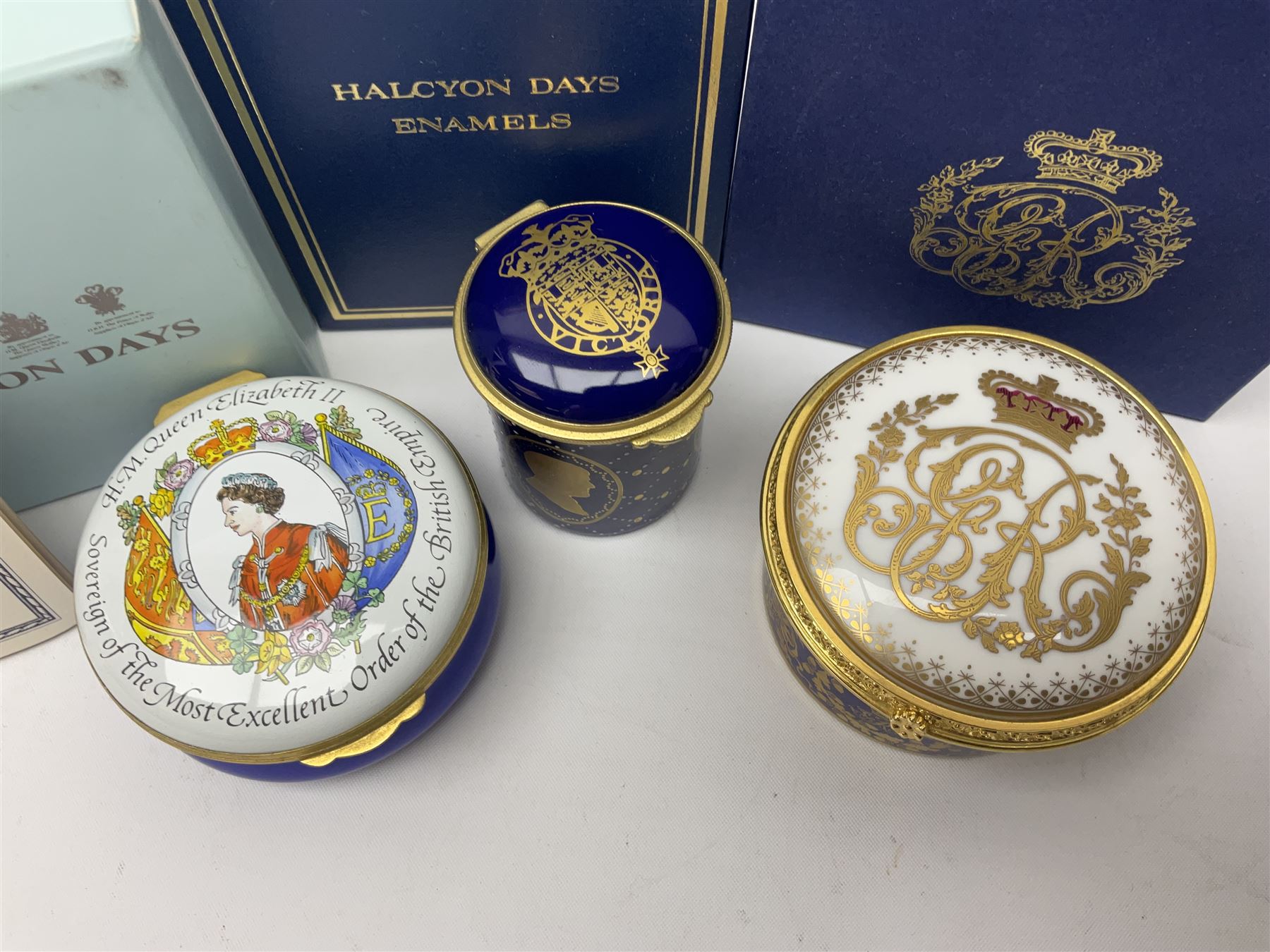 Five Halcyon Days Royal commemorative enamel boxes and one other similar enamel box, including two gilt examples depicting the Queen and Prince Philip in profile, to commemorate their 80th ad 85th birthdays respectively, all boxed, largest D6.5cm