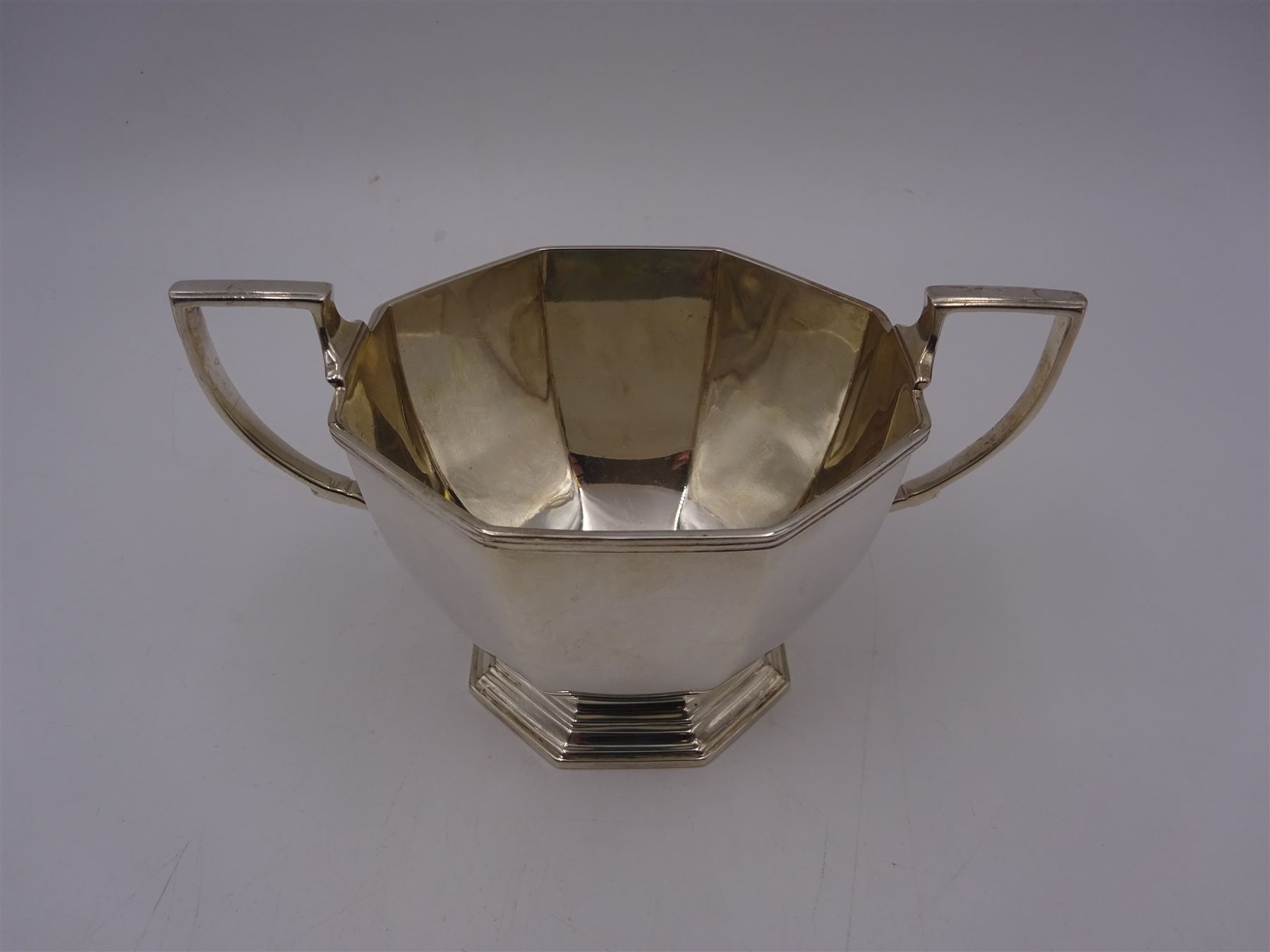 1930s century silver twin handled bowl, of faceted octagonal form with two angular handles, upon a hexagonal foot, hallmarked Mappin & Webb Ltd, Sheffield 1938, including handles H8.5cm