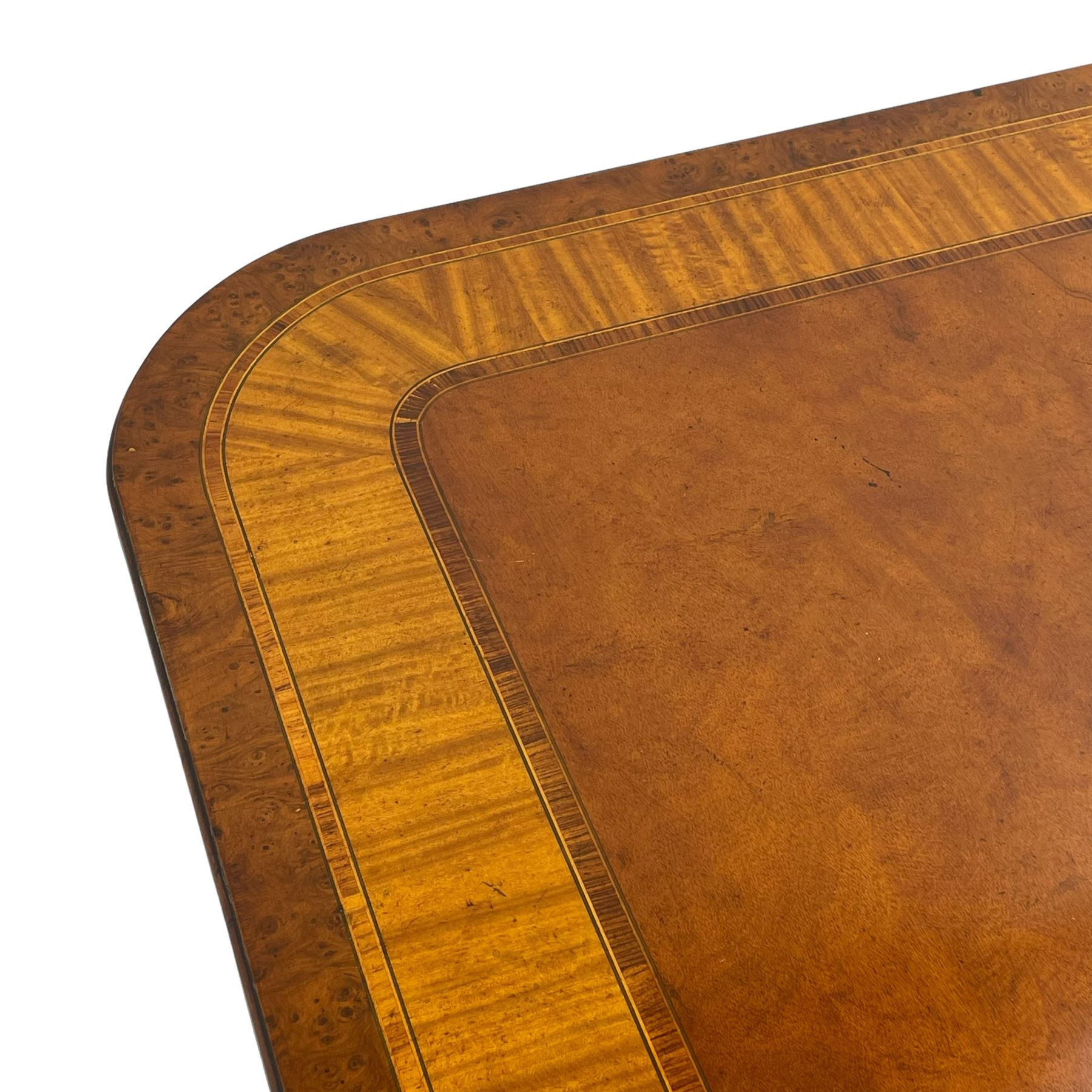 RBC Furniture (Made in England) - Georgian design mahogany dining table, rectangular top with rounded corners, satinwood and burr walnut bandings, two D-ends with two additional leaves and support rails, on barrel turned pedestals with four out-splayed reeded supports, brass cups and castors 