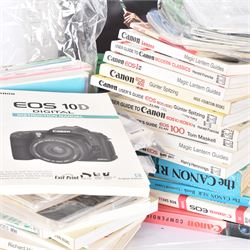 Large collection of Canon camera reference books, brochures, user's guides and instruction manuals, including Canon Compendium by Bob Shell, copies of Lens Wonderland, EOS camera guides, etc 