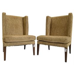 Two wing back armchairs, upholstered in oatmeal fabric