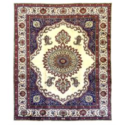 Northwest Persian signed Tabriz ivory ground carpet, central medallion with intricate flor...