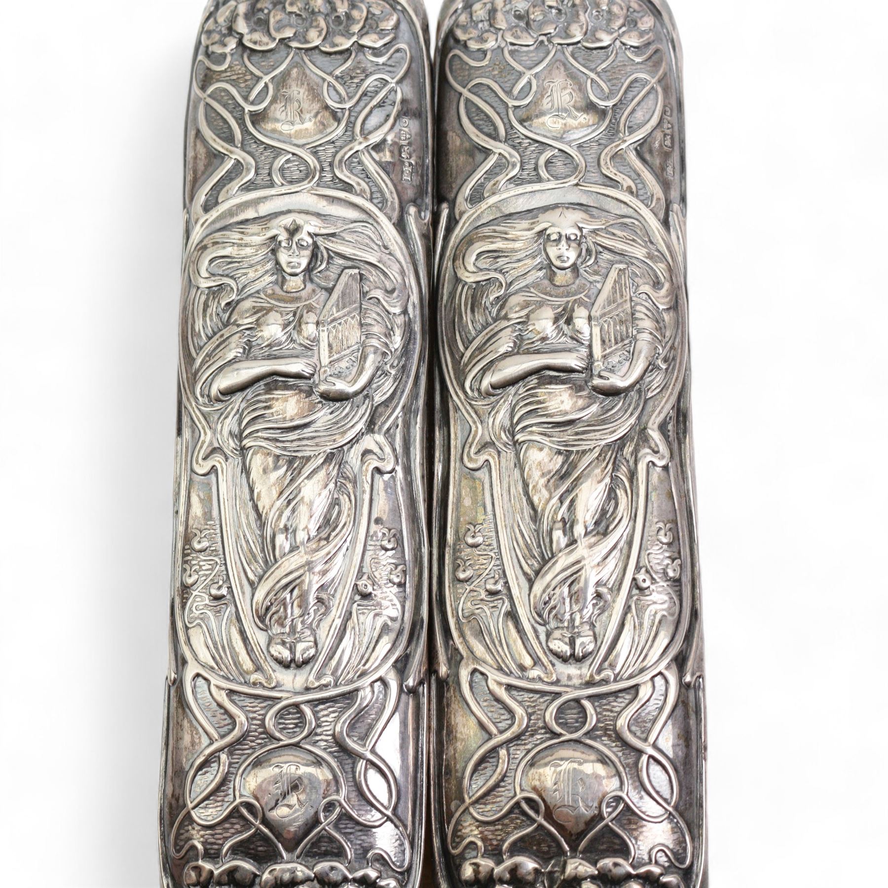 Pair of Art Nouveau silver backed clothes brushes with female figures holding zithers Chester 1903 Maker Rolason Bros and a pair of sugar nips 