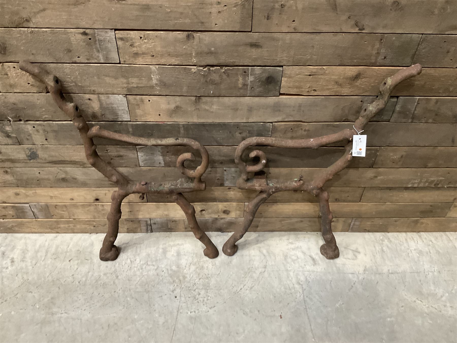 Pair of faux bois cast metal bench ends; together with wooden slatted bench with metal ends