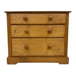 Victorian pine and satinwood chest, fitted with three graduating drawers, on skirted base with castors