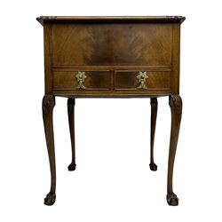 Early 20th century mahogany work table, hinged top enclosing satin-lined compartment with pincushion and pockets, lower section fitted with two drawers with dividers, on cabriole supports with carved knees and claw feet