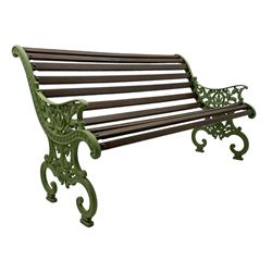 20th century cast iron and wood slatted 'Lilly of the Valley' garden bench, cast iron bench ends of scrolled form decorated with trailing foliage and flower heads, on scrolled supports 