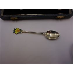 Set of six silver coffee spoons, each with enamelled daffodil decoration to terminal, hallmarked Turner & Simpson Ltd, Birmingham 1938, contained within fitted case